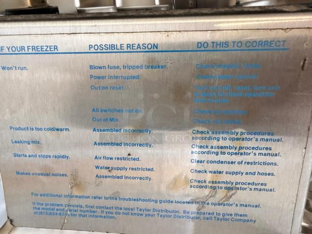 Alt text: Taylor Y339-27 soft serve ice cream machine panel displaying troubleshooting instructions; excellent condition.