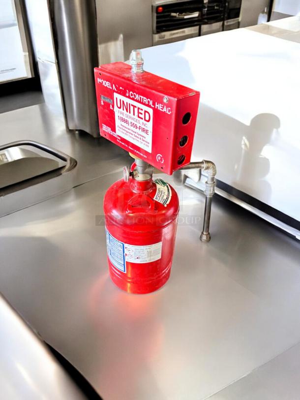 PyroChem PCL-160 Kitchen Knight II fire suppression system, excellent condition, fully tested, red cylinder with labels visible.