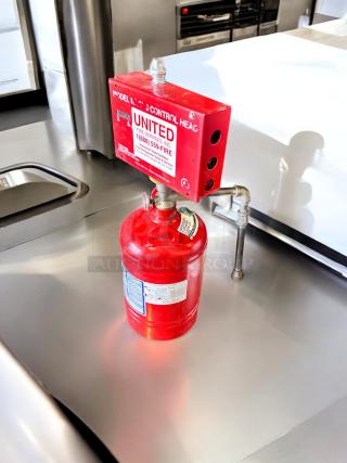 PyroChem PCL-160 Kitchen Knight II fire suppression system, excellent condition, fully tested, red cylinder with labels visible.