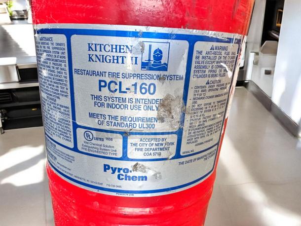 PyroChem PCL-160 Kitchen Knight II fire suppression system, excellent condition, tested, with UL300 label visible.