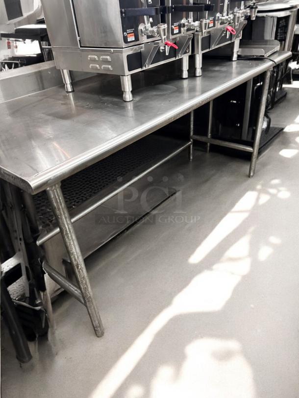 Commercial grade stainless steel work table, 36"W x 30"D x 36"H, in excellent condition. Fully tested and working.