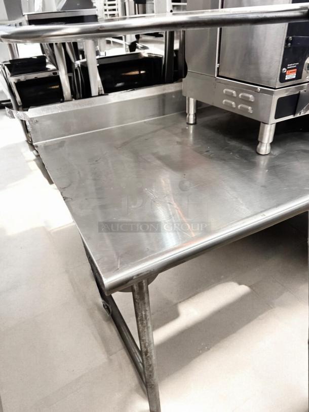 Commercial grade stainless steel work table, 36"W x 30"D x 36"H, excellent condition, fully tested, durable design.