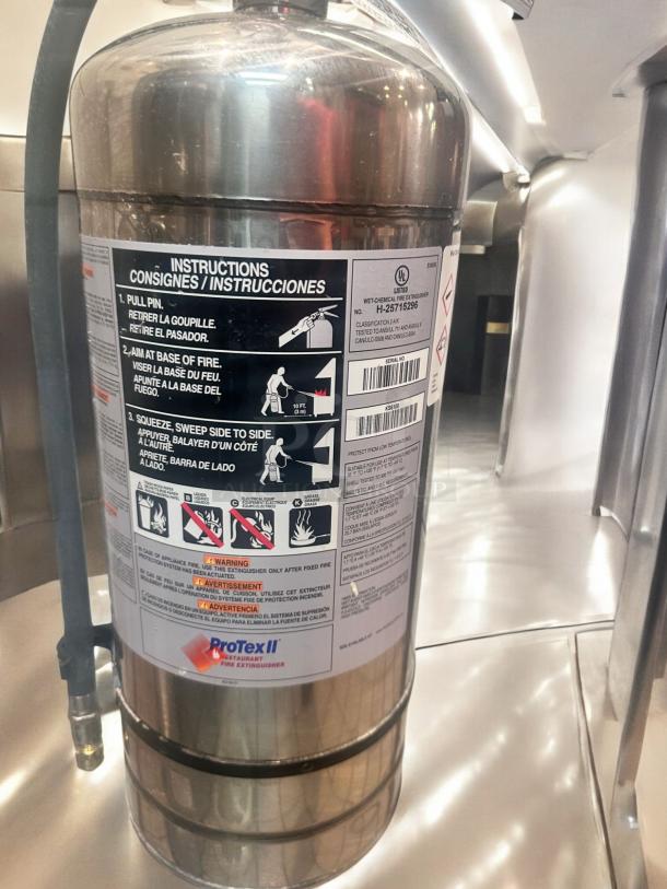 ProTex II KS6100 wet chemical fire extinguisher, stainless steel, excellent condition, fully tested; instruction label visible.