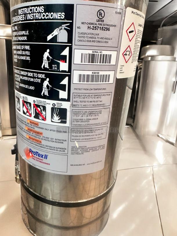 ProTex II KS6100 wet chemical fire extinguisher, stainless steel, excellent condition, fully tested, visible instructions and safety labels.