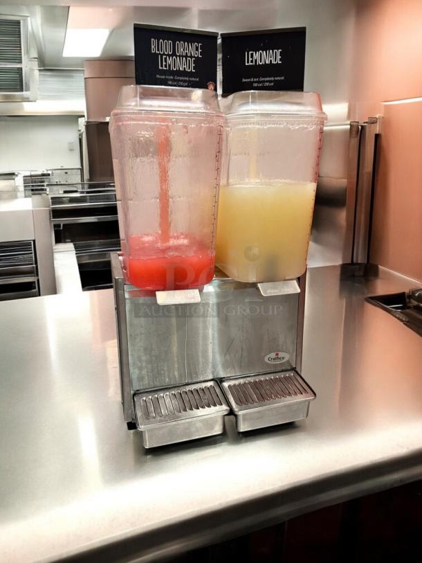 Crathco D25-3 dual tank cold beverage dispenser, excellent condition, fully tested, 115V, with lemonade labels.