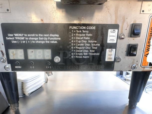 Javo Hot Beverage Dispenser, excellent condition, 120V, fully tested. Visible function code panel with buttons and switches.