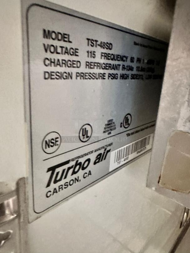 Turbo Air TST-48SD label shows specs: 115V, frequency 60Hz, refrigerant R-134a. NSF, UL certified. Excellent condition.