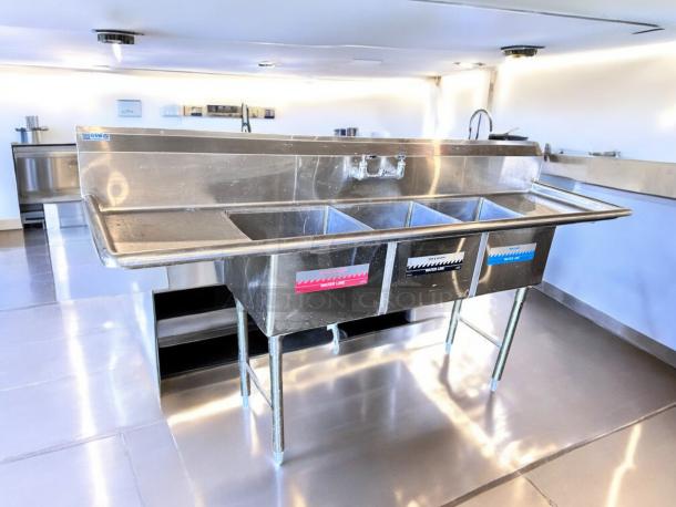 GSW 3-compartment stainless steel sink with dual drainboards, NSF certified, excellent condition, fully tested.