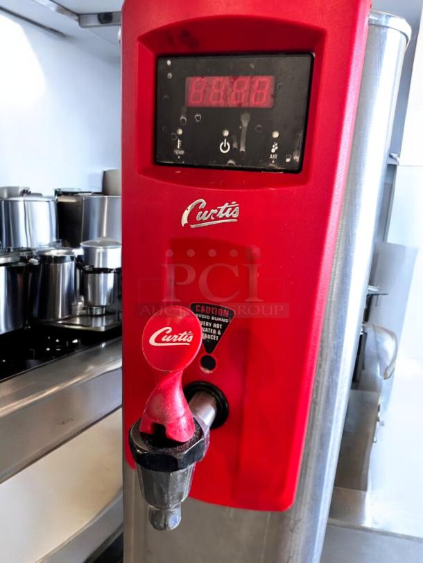 Curtis WB5N Digital Hot Water Dispenser in excellent condition, fully tested, 120V. Bright display and Curtis branding visible.