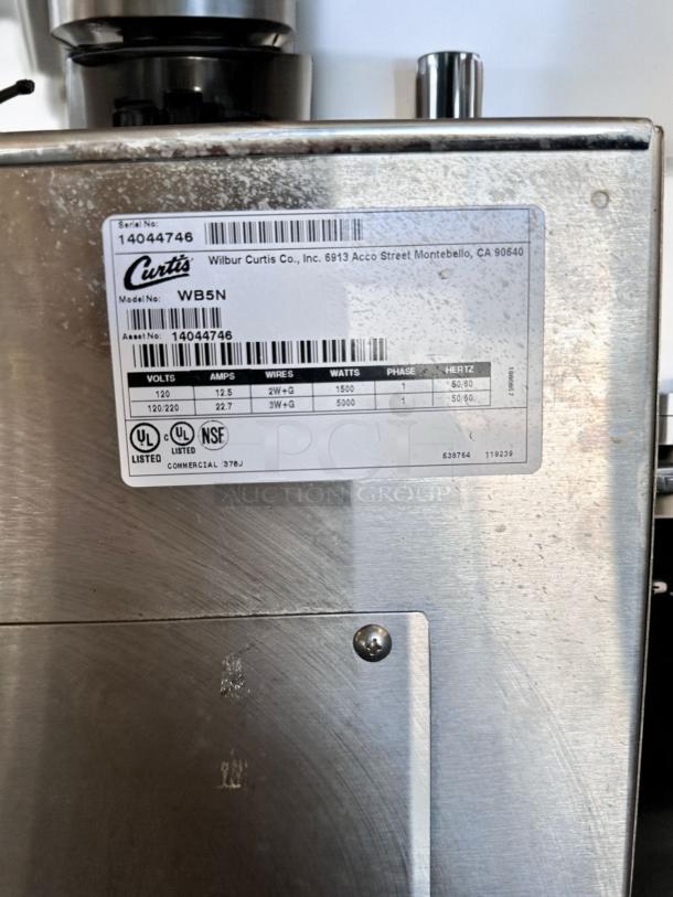 Curtis WB5N digital hot water dispenser, excellent condition, fully tested, 120V, stainless steel finish, model label visible.