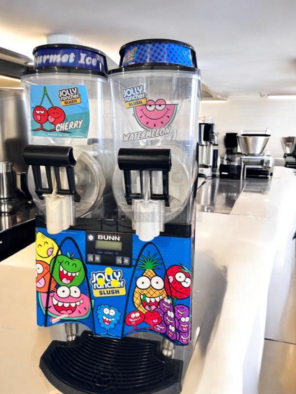 Bunn ULTRA-2 Dual Tank Jolly Rancher Slush Machine, excellent condition, 120V, fully tested, vibrant branding, Cherry/Watermelon flavors.