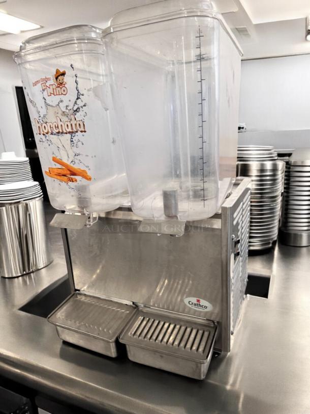 Crathco D25-3 dual bowl cold beverage dispenser in excellent condition. Fully tested, working 115V model with horchata label.