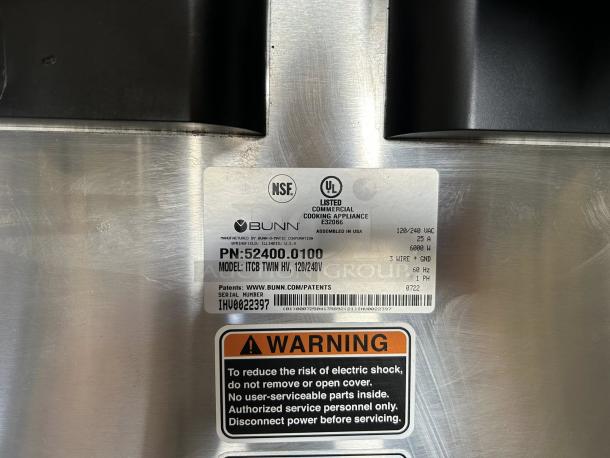 Bunn ITCB TWIN tea/coffee brewer label, model 52400.0000, showing voltage, capacity, and safety warning details.