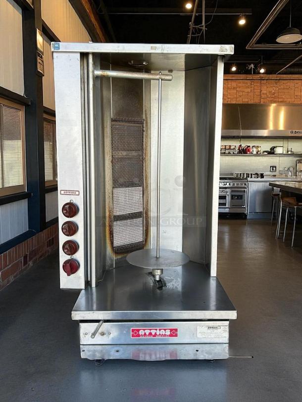 Attias GRY-4 gyro and shawarma machine with 4 burners and 1 spit. In great condition, tested and working.