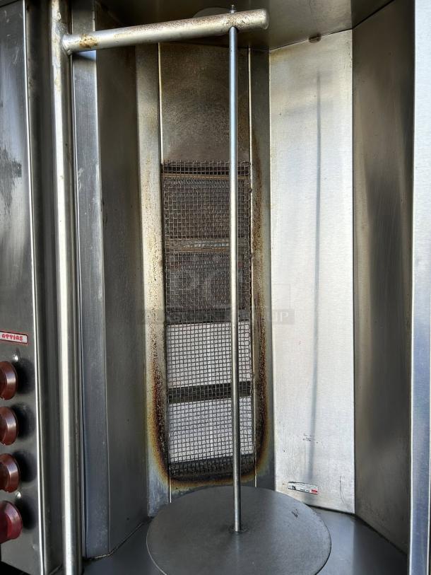 Attias GRY-4 gyro machine, 4 burners, great condition, tested, working, includes 1 spit, visible control knobs and label.