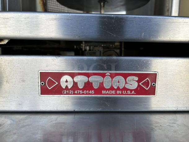 Attias GRY-4 Gyro & Shawarma Machine with 4 burners, 1 spit. Great condition, stainless steel, "Made in U.S.A." label visible.