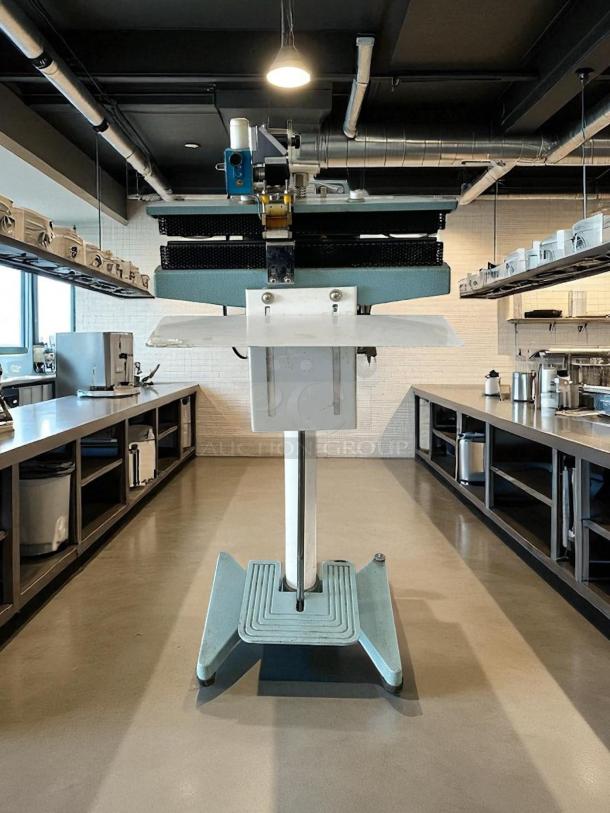 12" Constant Heat Foot Sealer with Lined Jaw, 115v; excellent condition, tested and working. Industrial kitchen setting.