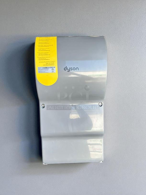Silver Dyson Airblade hand dryer, model 13043-01, in excellent condition with safety label visible.