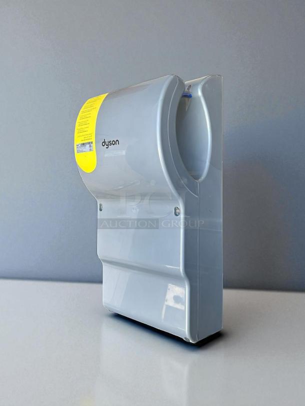 Dyson Airblade Hand Dryer, model 13043-01, in excellent condition. Silver with visible brand and label. Tested working.