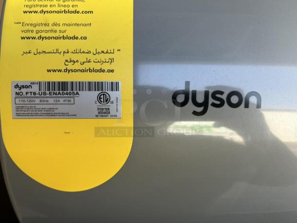 Dyson Airblade hand dryer, model 13043-01, silver, excellent condition, tested working. Visible labels show serial and power info.