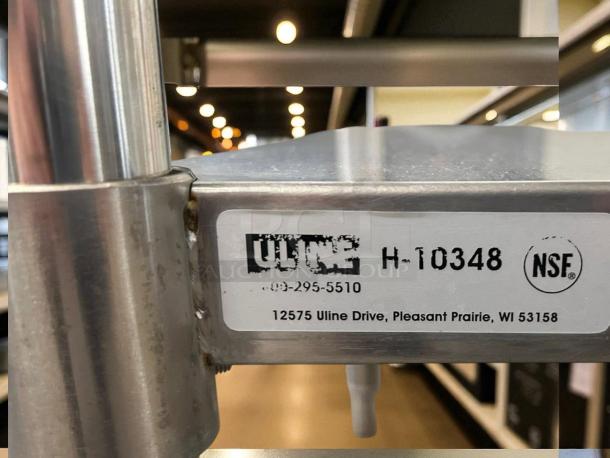 Uline Stainless Steel Worktop Table, Model H-10348, perfect condition, NSF certified, visible label on side.