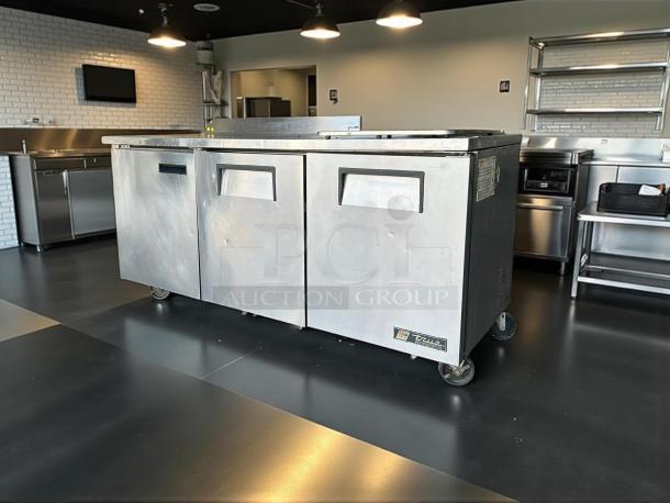 True TWT-72-HC worktop refrigerator, three doors, metal finish, 72 3/8" width, 3 9/16" backsplash, in great condition, fully tested.
