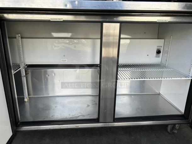 True TWT-72 worktop refrigerator, 72 3/8" with 3 9/16" backsplash, tested and working, shelves inside, "Bakers Only" labels.
