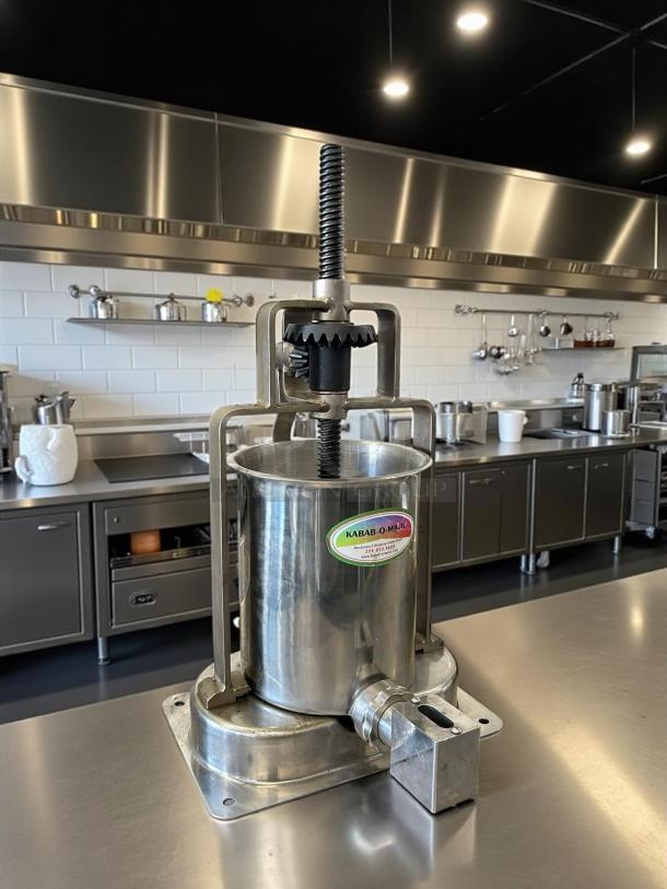 Kabob-O-Matic 13741 sausage stuffer, manual, stainless steel, 7 KG capacity; great condition; visible brand label.