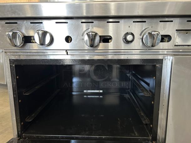 Atosa AGR-2B24GR gas range with 2 burners, 24" griddle, and oven. Stainless steel, fully tested, excellent condition.
