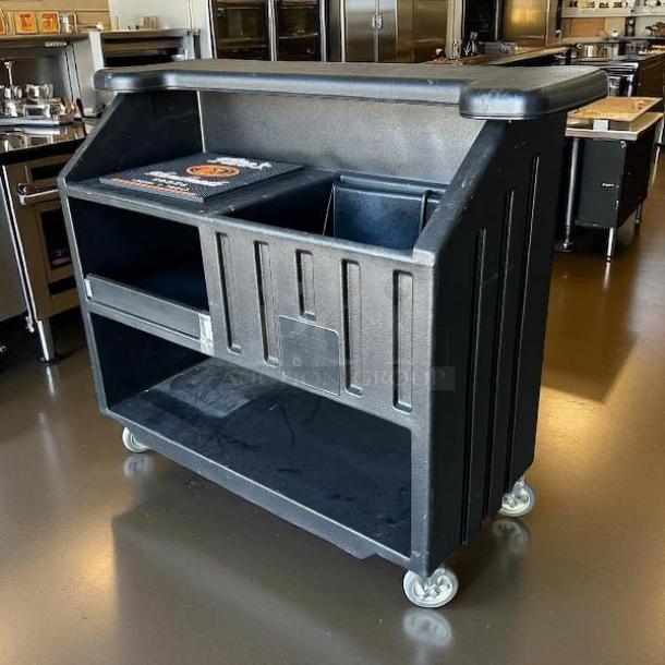 Cambro BAR540110 Cambar® black 54" portable bar with 5-bottle speed rail, excellent condition, fully tested, on wheels.