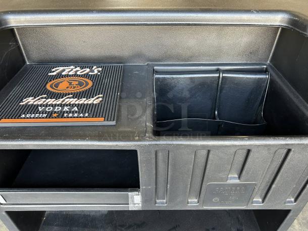 Cambro BAR540110 Cambar® Black 54" portable bar with 5-bottle speed rail in excellent condition. Label reads "Cambro".