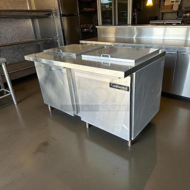Continental SW60-24M commercial refrigerator freezer, dual lid top access, stainless steel, 115V, fully tested and working.