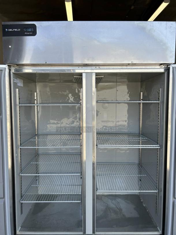Delfield GBR2P-S 2-door commercial reach-in refrigerator in excellent condition, with six adjustable shelves, 115V power.
