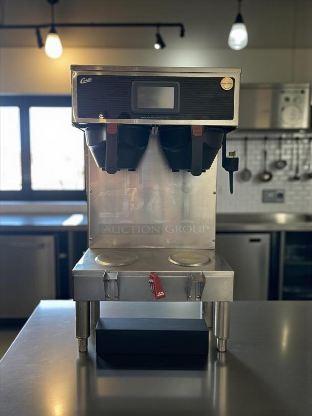 Wilbur Curtis G4GEMT10A1000 dual automatic coffee brewer, excellent condition, 220V, fully tested, visible control panel.