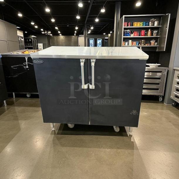 Krowne BR48 48" dry bar cabinet with 2 solid doors, black finish, excellent condition, tested and working, visible branding.