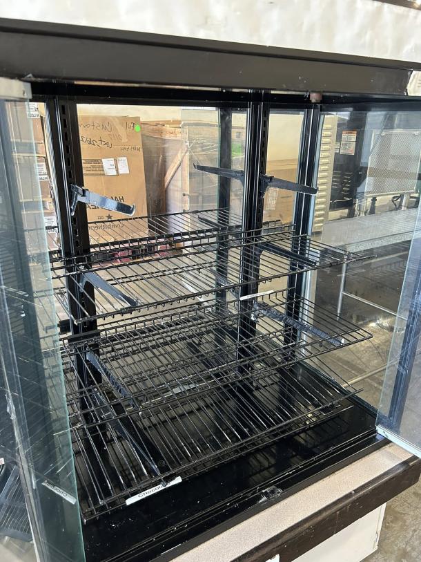 Hussmann DCB-243662 refrigerated merchandiser, 36" display case, black metal shelves, outstanding condition, 115V, fully tested.