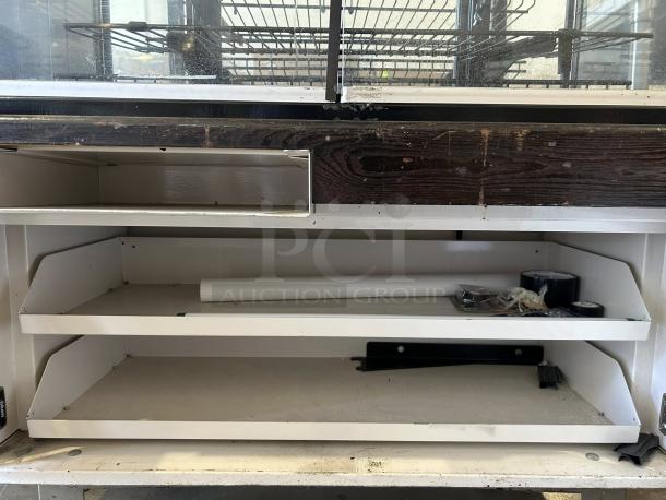 Hussmann DCB-243662 refrigerated merchandiser, 36" display case, fully tested, outstanding condition, 115V, visible storage shelves.