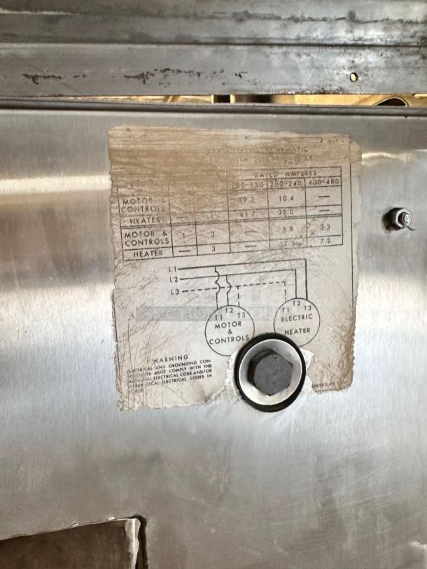 Hobart AM-12 commercial dishwasher panel with wiring diagram. Stainless steel surface, visible bolt. High-temperature, 208-230V.