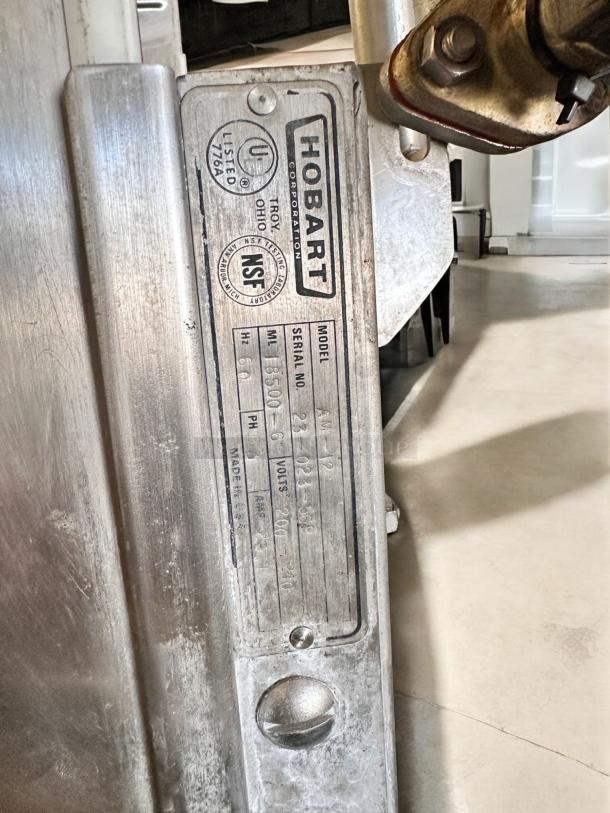 Hobart AM-12 commercial dishwasher label with model and serial number. High-temperature, 208-230V, fully tested.