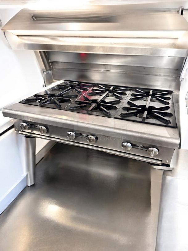 Imperial 6-burner gas range in excellent condition, heavy-duty stainless steel, fully tested, working, commercial kitchen use.