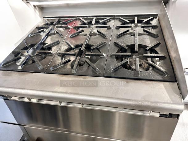 Imperial 6-burner gas range in excellent condition, heavy-duty stainless steel construction, fully tested and working.