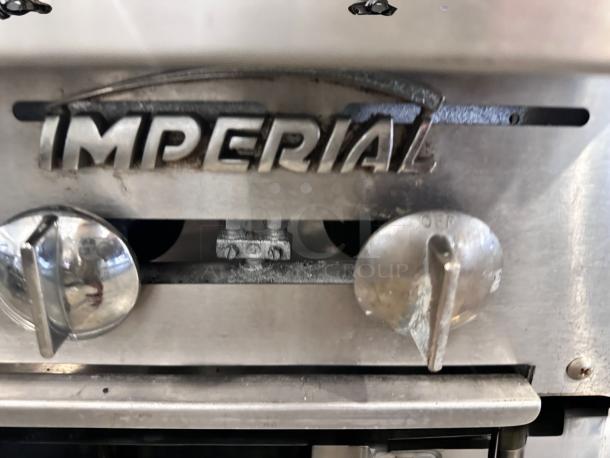 Imperial 6-burner gas range, heavy-duty stainless steel, branded knobs, excellent condition, fully tested and working.