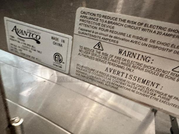 Avantco 177STE45A 4-Pan Electric Steam Table, excellent condition, 120V, "Made in China" and safety warnings visible on labels.