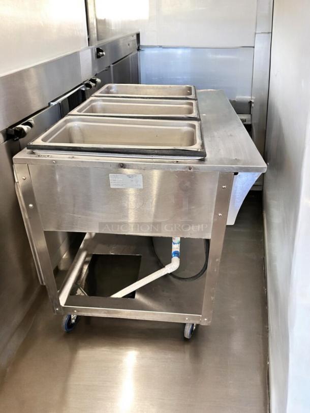ServeWell SRP12 steam table in pristine condition, featuring four pans, 120V, fully tested and operational.
