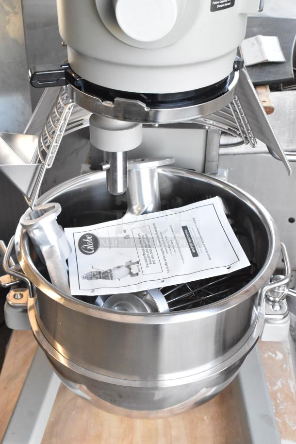 BRAND NEW Globe SP30 30 Quart Planetary Dough Mixer with mixing bowl, bowl guard, dough hook, whisk, and paddle attachments.