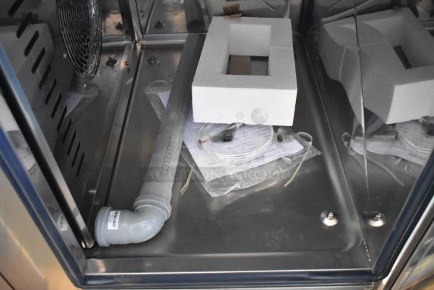 BRAND NEW! Bakers Pride AEHE061R commercial combi convection oven interior with packaging, stainless steel finish. 208V, 3 Phase.