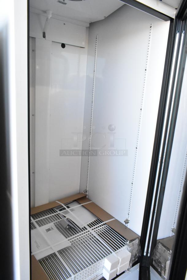 Brand new True TSCI-600R-G-PH commercial cooler with single glass door, poly-coated racks, 115V, 1 phase; empty interior view.