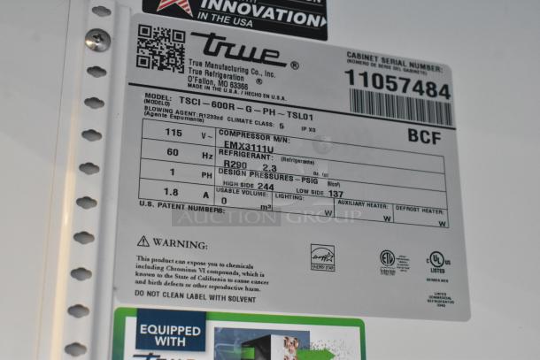 BRAND NEW True TSCI-600R-G-PH commercial cooler tag, 115 volts, 1 phase, poly coated racks, model info and specifications.