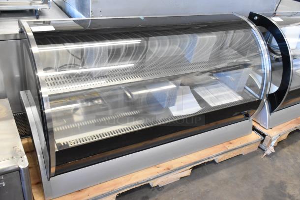 Brand new Vollrath RDE8160 60" countertop curved glass refrigerated display cabinet. Model 40854, 120 volts, 1 phase.
