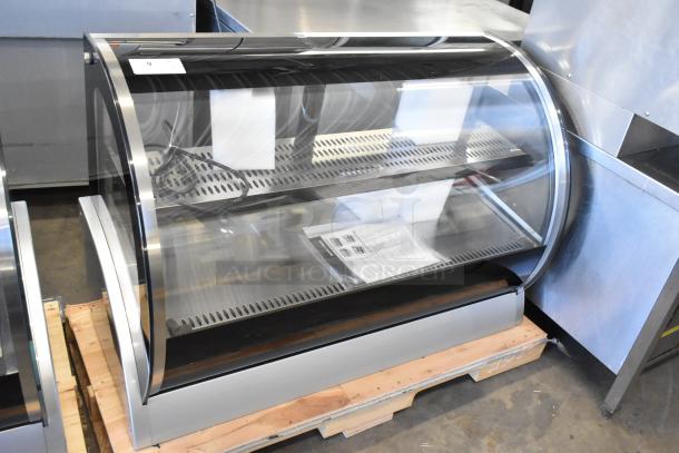 Brand new Vollrath RDE8148 48" curved glass refrigerated display cabinet, 120V, 1 phase, in pristine condition.